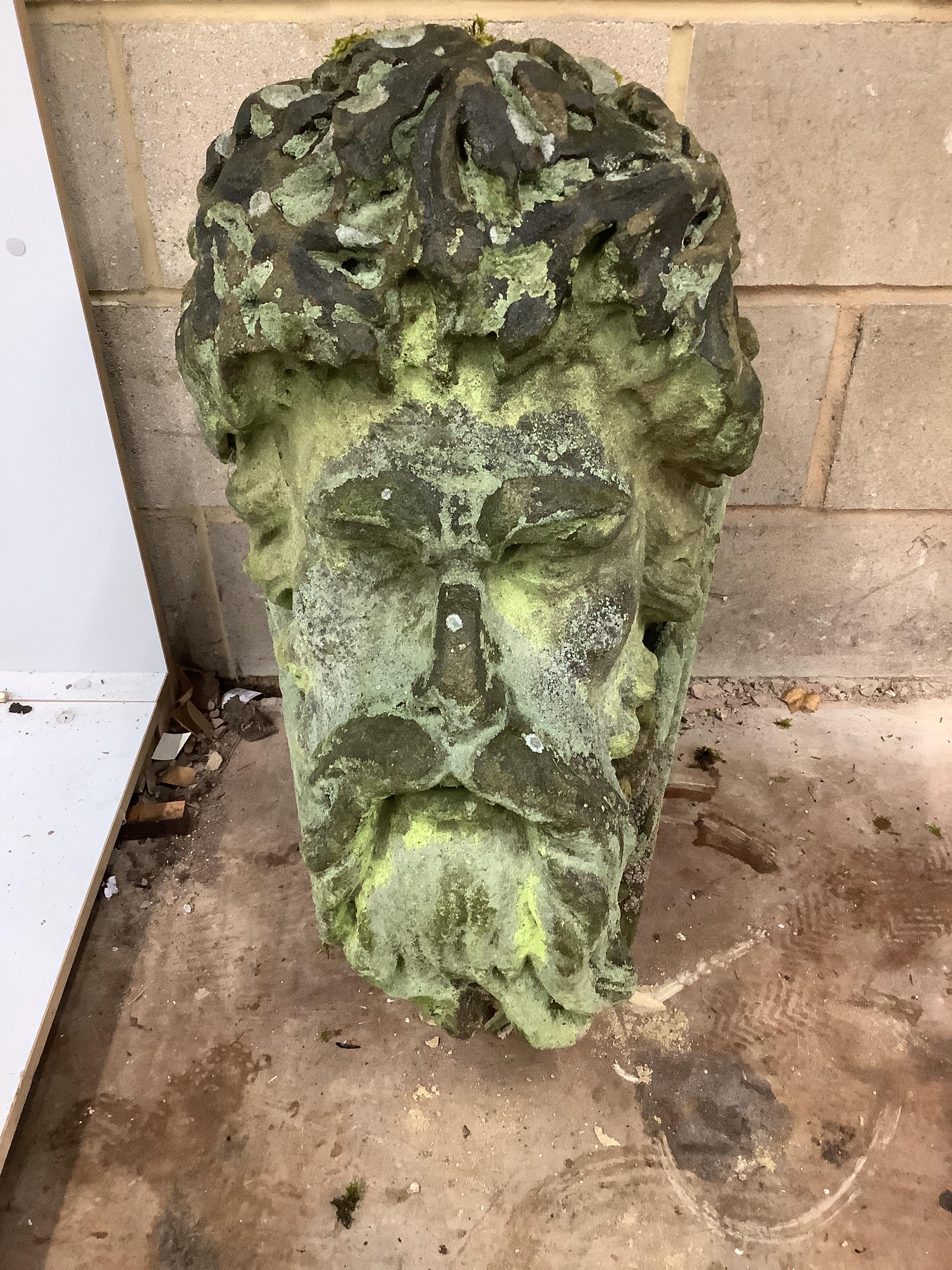 A 19th century carved stone head of Green Man / Neptune, width 40cm, height 68cm